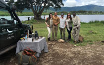 <p>Our crew (minus Robbie) with our awesome andBeyond Safari guide, Peter. Behind us is a hippopotamus watering hole. We stopped for a snack and coffee with Amarula, which is the best type of Baileys you can ever imagine. </p>