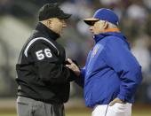 New York Mets manager Terry Collins, right, argues a call by first base umpire Eric Cooper during the third inning of a baseball game against the Atlanta Braves, Friday, April 18, 2014, in New York. (AP Photo/Frank Franklin II)