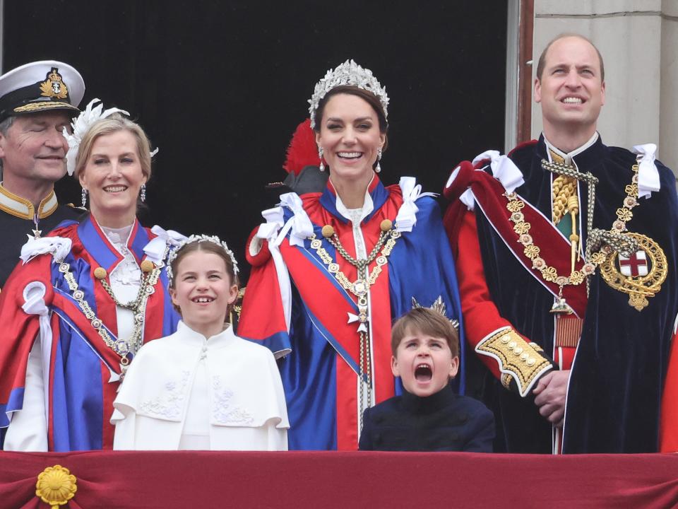 Sohie, Duchess of Edinburgh, Princess Charlotte, Kate Middleton, Prince William, and Prince Louis appear on the balcony of Buckingham Palace after the coronation of King Charles