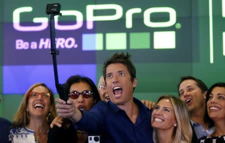 GoPro Inc's founder and CEO Nick Woodman (C) celebrates GoPro Inc's IPO with family and staff at the Nasdaq Market Site in New York City, June 26, 2014. REUTERS/Mike Segar