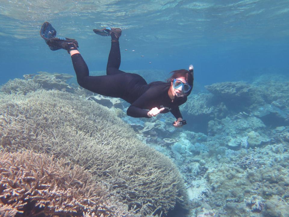 Adi Khen, a graduate student studying corals, snorkels in one of Palmyra Atoll’s vibrant reefs.Courtesy of The Nature Conservancy / Mike Fox