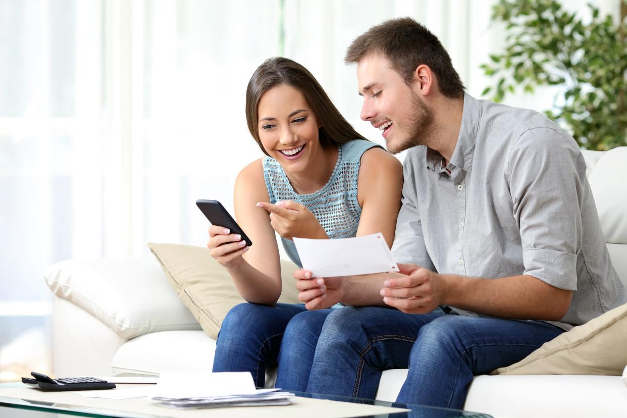 Couple at home doing finances