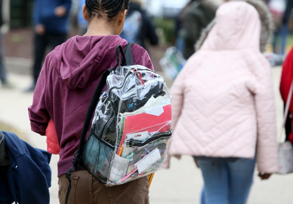 Students use clear backpacks for security concerns Thursday, Dec. 15, 2022, at Navarre Middle School in South Bend. Navarre is in the South Bend school district's Empowerment Zone.