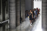 Models wear creations as part of the Bottega Veneta Spring-Summer 2020 collection, unveiled during the fashion week, in Milan, Italy, Thursday, Sept. 19, 2019. (AP Photo/Antonio Calanni)