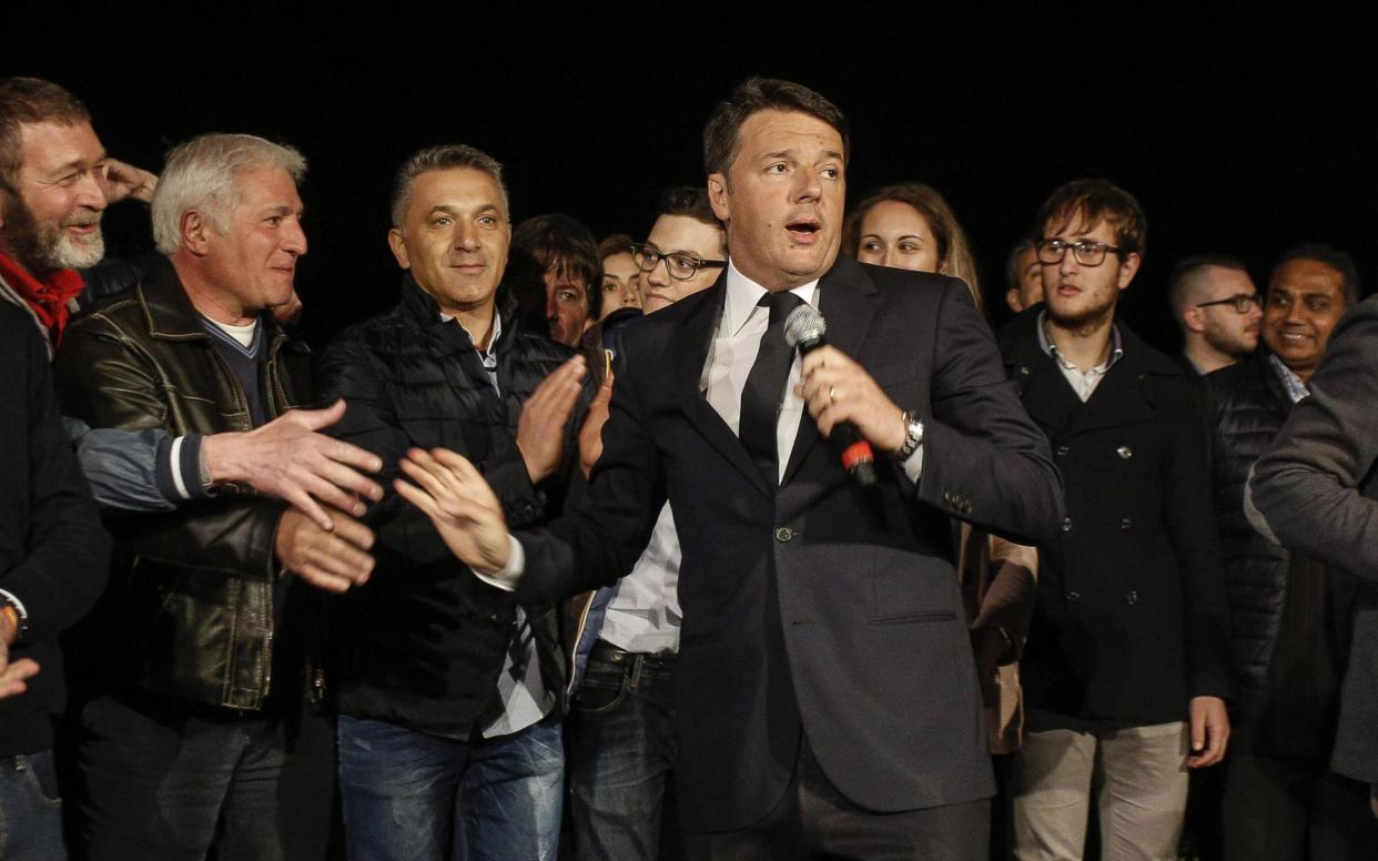 Matteo Renzi, centre, speaks after winning the Democratic Party's primary election - ANSA