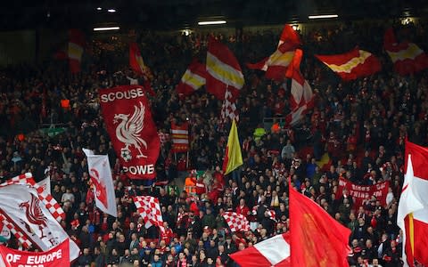 The flags are out on the Kop - Credit: AP Photo/Dave Thompson