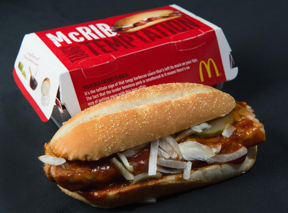 TO GO WITH AFP STORY US-FOOD-SOCIETY-MCDONALD'S A photo of a McDonalds' McRib sandwich, November 2, 2010. Fast food giant McDonald's is bringing back a sandwich -- the McRib -- that gained cult acclaim over the last three decades, in a move lauded by fans known to travel great distances in the hunt for the coveted treat.The boneless pork chop between a bun and slathered with tangy BBQ sauce, topped with onions and pickles, was first launched in 1981, and with rare exceptions has only been offered for sale in select McDonald's for a few weeks at a time. From Tuesday, it will be available nationwide, and for an entire month. AFP Photo/Paul J. Richards (Photo credit should read PAUL J. RICHARDS/AFP/Getty Images)