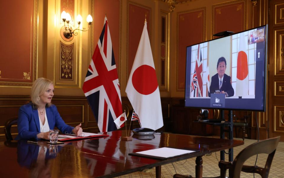 International Trade Secretary Liz Truss speaking to Japan's Minister for Foreign Affairs Toshimitsu Motegi