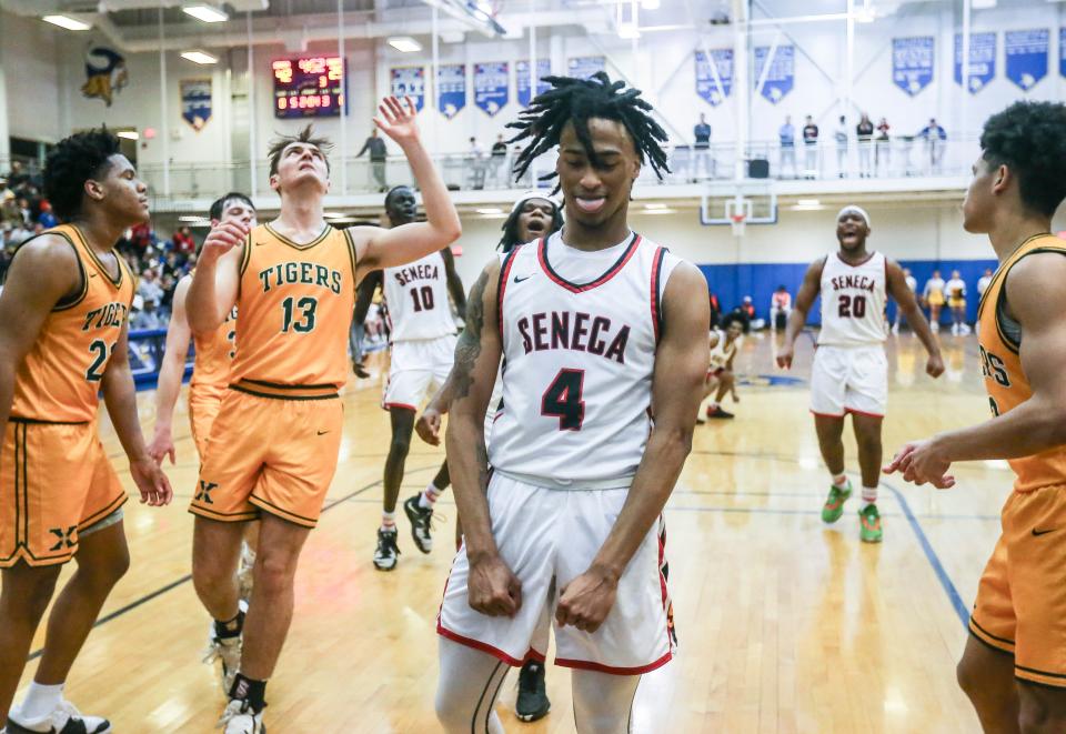 Seneca's QuelRon House (4) reacts after scoring two -- and drawing the foul -- of his 26 points as the RedHawks roll past No. 7 St.X 76-49 at the Seventh Region semifinal Friday at Valley High School. March 8, 2024