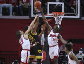 Rutgers guard Caleb McConnell, left, and center Clifford Omoruyi defend against a shot by Iowa forward Keegan Murray (15) during the first half of an NCAA college basketball game Wednesday, Jan. 19, 2022, in Piscataway, N.J. (Andrew Mills/NJ Advance Media via AP)