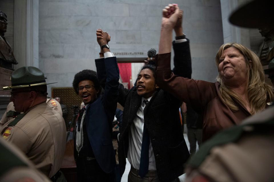 Reps. Justin Pearson, Justin Jones and Gloria Johnson on April 3 greet protestors in solidarity outside the House chamber amid chaotic scenes inside the Tennessee Capitol after Republican lawmakers voted to hold expulsion hearings for the three Democrats.