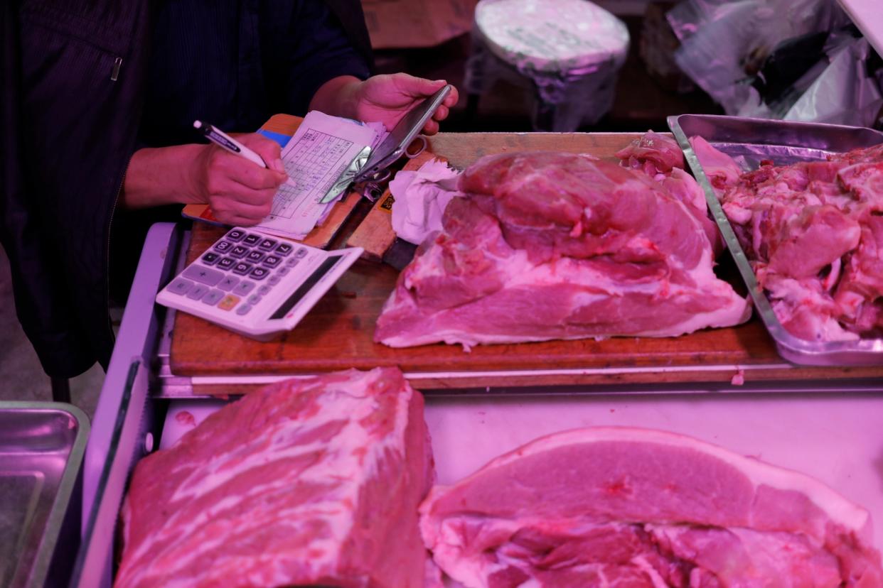 Pork on display at a market in Beijing, China. A huge swine fever epidemic has fuelled inflation and hurt consumer spending: EPA