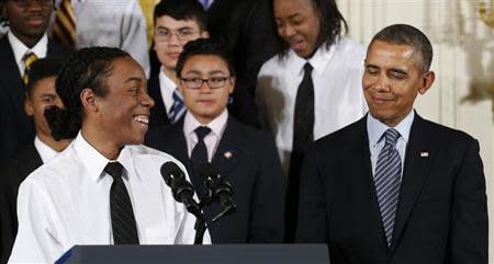 U.S. President Barack Obama reacts as he is introduced to speak by Christian Champagne, 18, from Chicago at the unveiling of Obama's "My Brother's Keeper" initiative at the White House in Washington February 27, 2014. REUTERS/Kevin Lamarque