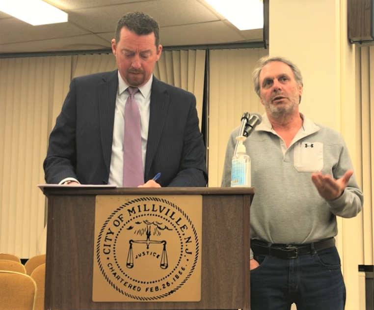 Angelo Gaudelli, (right) president of Gaudelli Enterprises LLC, testifies Monday night before the Millville Planning Board about a plan to construct a facility at 700 Orange St. The board gave final approval to phase one of the project and preliminary approval to phase two. He stands with his attorney, Kristopher Facenda. PHOTO/Jan. 9, 2023.