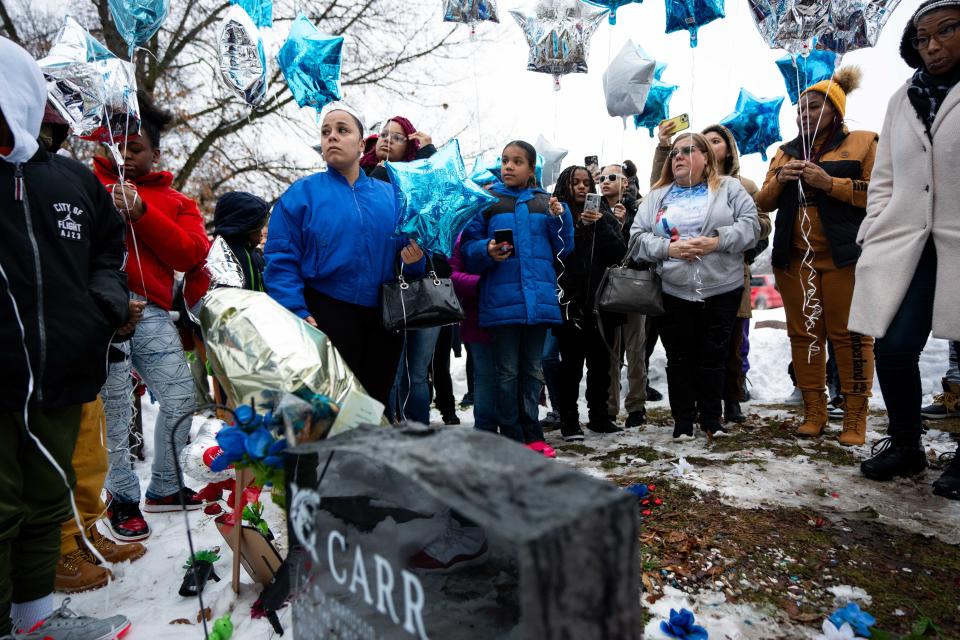 Friends and family gather to honor the lives of Rashad Carr and Gionni Dameron on the first anniversary of the Starts Right Here shooting Tuesday, Jan. 23, 2024, at Glendale Cemetery in Des Moines.