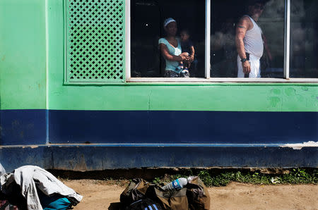 Venezuelan people are pictured at bus terminal, after being expelled from the Pacaraima border control point by civilians in Brazil, in Santa Elena, Venezuela August 19, 2018. REUTERS/Nacho Doce