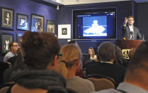 An auctioneer asks for prices during an auction of pictures by late celebrity photographer Milton H. Greene, in Warsaw, Poland, Thursday, Nov. 8, 2012. (AP Photo/Alik Keplicz)
