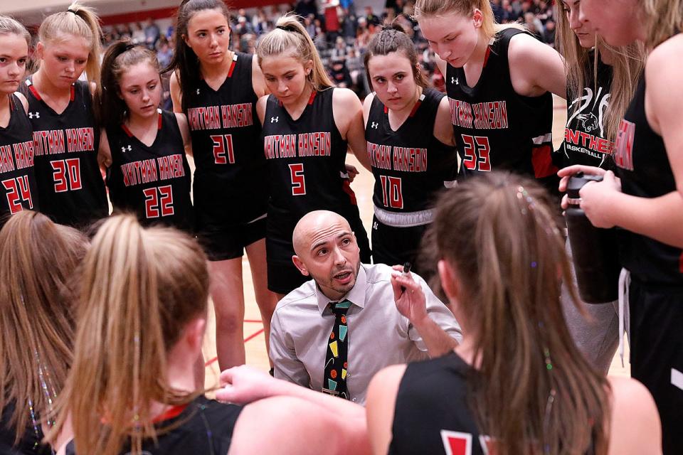 Coach Michael Costa talks with his squad during a time out.Whitman-Hanson High girls basketball defeated Walpole 43-41 in MIAA tournament action at Milton High on Friday March 11, 2022  