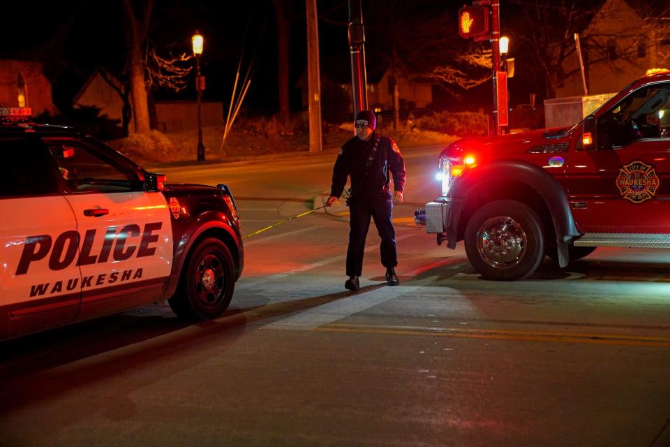 police man walks site near suv speeding Wisconsin