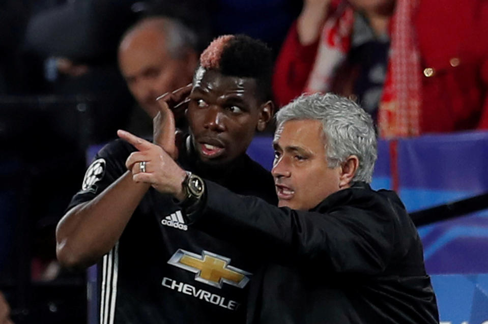 Manchester United manager Jose Mourinho speaks with Paul Pogba during a match. (Reuters)