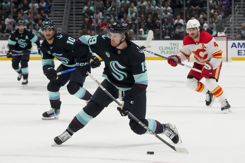 Seattle Kraken left wing Jared McCann shoots against the Calgary Flames during the first period of an NHL hockey game Monday, Nov. 20, 2023, in Seattle. (AP Photo/Lindsey Wasson)