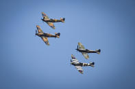 A flypast to mark the 80th anniversary of the Battle of Britain flies over Westminster Abbey, London.