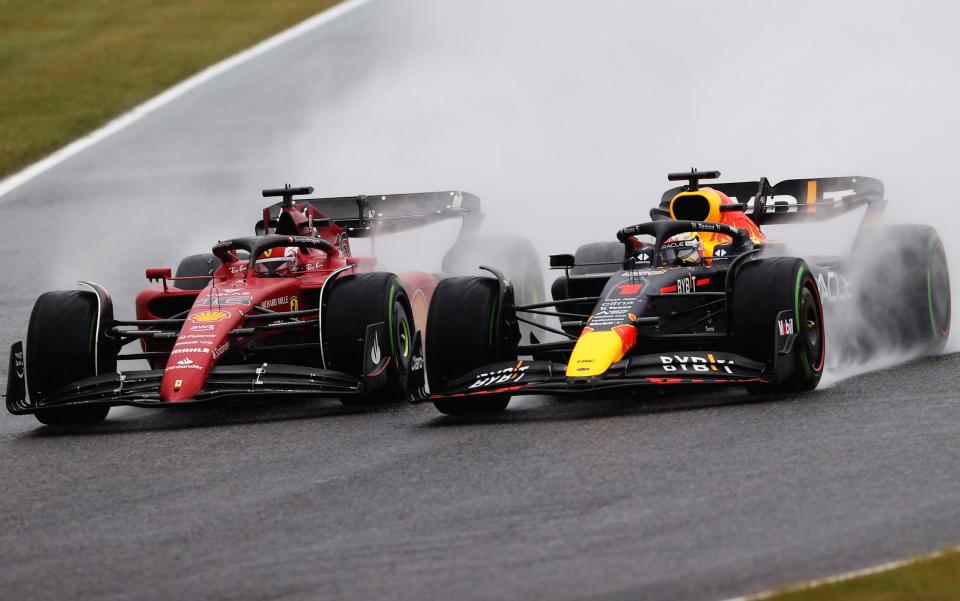  Max Verstappen of the Netherlands driving the (1) Oracle Red Bull Racing RB18 and Charles Leclerc of Monaco driving the (16) Ferrari F1-75 battle for track position at the start during the F1 Grand Prix of Japan at Suzuka International Racing Course on October 09, 2022 in Suzuka, Japan - Getty Images