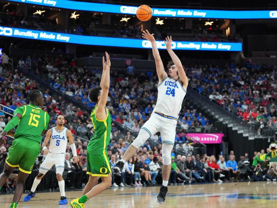 UCLA Bruins guard Jaime Jaquez Jr. (24) shoots over Oregon Ducks guard Will Richardson (0) during the second half on March 10, 2023, at T-Mobile Arena in Las Vegas, Nevada.