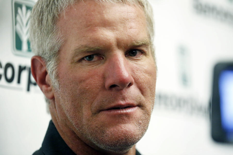 FILE - Former NFL quarterback Brett Favre speaks with reporters prior to his induction to the Mississippi Hall of Fame in Jackson, Miss., Aug. 1, 2015. Mississippi Attorney General Lynn Fitch sued Mississippi Auditor Shad White on Thursday, Feb. 22, 2024, saying the auditor is encroaching on the attorney general's power to try to recover misspent welfare money from Favre. (AP Photo/Rogelio V. Solis, File)