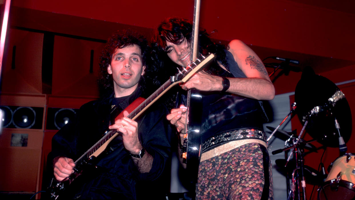  Joe Satriani (left) and Steve Vai perform onstage at the Limelight in Chicago, Illinois on June 27, 1987. 