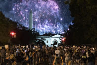 The silouhette of Andrew Jackson's statue is seen as Fireworks paint the sky above the obelisk of the Washington Monument while demonstrators, protesting the nomination of Donald Trump, watch at Black Lives Matter plaza across from the White House on August 27, 2020 in Washington, DC. - President Donald Trump accepts the Republican Party nomination for reelection tonight, August 27 against storm clouds of racial tension, riots and the coronavirus pandemic -- while warning of "chaos" should he lose to Democrat Joe Biden. (Photo by Jose Luis Magana / AFP) (Photo by JOSE LUIS MAGANA/AFP via Getty Images)