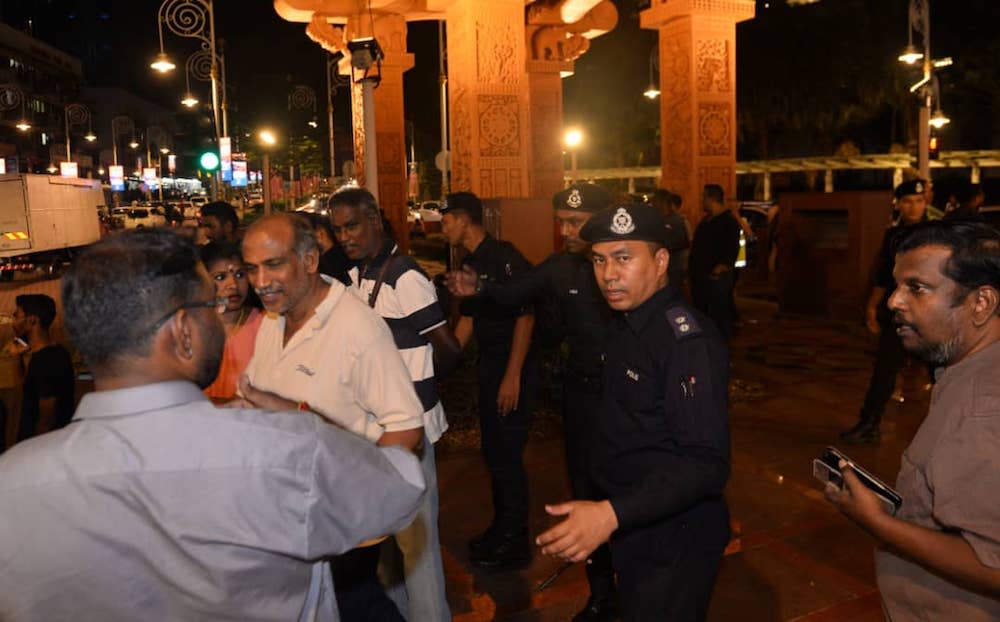 Police monitor a rally in Brickfields, Kuala Lumpur August 23, 2019.