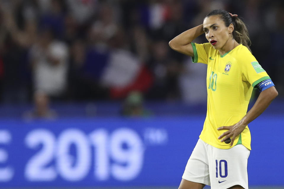 Brazil's Marta stands on the pitch at the end of the Women's World Cup round of 16 soccer match between France and Brazil at the Oceane stadium in Le Havre, France, Sunday, June 23, 2019. France beat Brazil 2-1. (AP Photo/Francisco Seco)