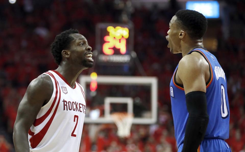 The Rockets' Patrick Beverley (left) and the Thunder's Russell Westbrook (right) yell at each other during the second half of Game 5. (AP/David J. Phillip)
