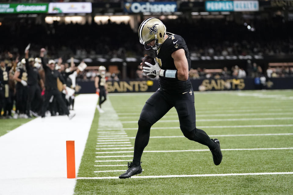 New Orleans Saints' Taysom Hill scores a touchdown during the first half of an NFL football game against the Chicago Bears in New Orleans, Sunday, Nov. 5, 2023. (AP Photo/Gerald Herbert)