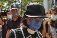 Mrs. Poon, the mother of a young woman killed in Taiwan, speaks to the media outside the government headquarters in Hong Kong, Wednesday, Oct. 20, 2021. Mrs. Poon, whose daughter Poon Hiu-wing was killed while visiting Taiwan in 2018, has lambasted Hong Kong authorities for letting suspect Chan Tong-kai walk free, instead of sending him to Taiwan to turn himself in. (AP Photo/Kin Cheung)