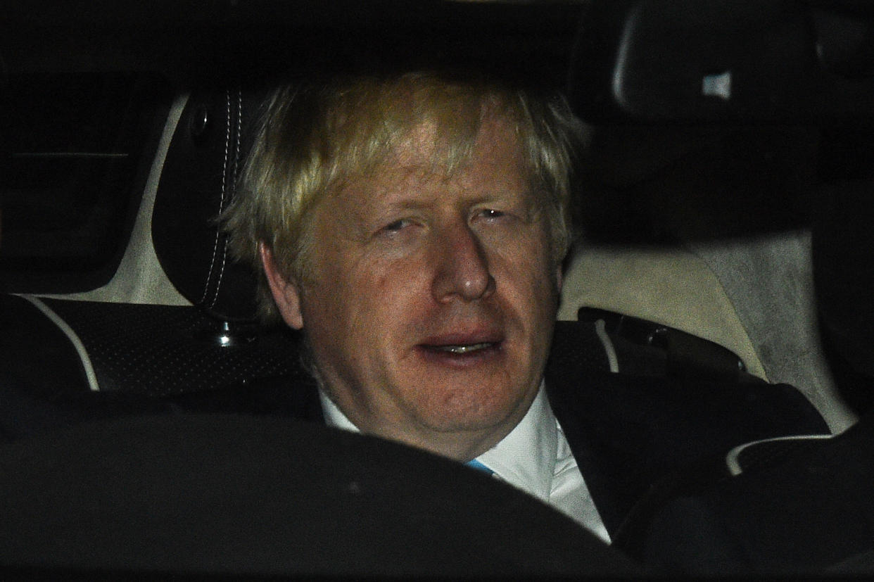 Prime minister Boris Johnson leaves Parliament after losing a Commons vote to force an early election 