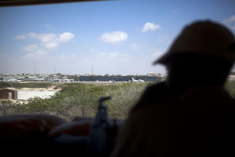 A private security guard looks out of a watchtower at the British embassy in Somalia, located inside Mogadishu International Airport, on February 19, 2015