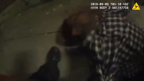 A thumbnail from police footage shows BPD Officer Jason Bellavance shoving Jeremie Meli, a Black man, into a wall in 2018. Meli sustained a traumatic brain injury from the incident and filed a lawsuit against the City of Burlington. Last June, the city awarded him and his brother, who was also injured in the interaction, a settlement of $750,000.