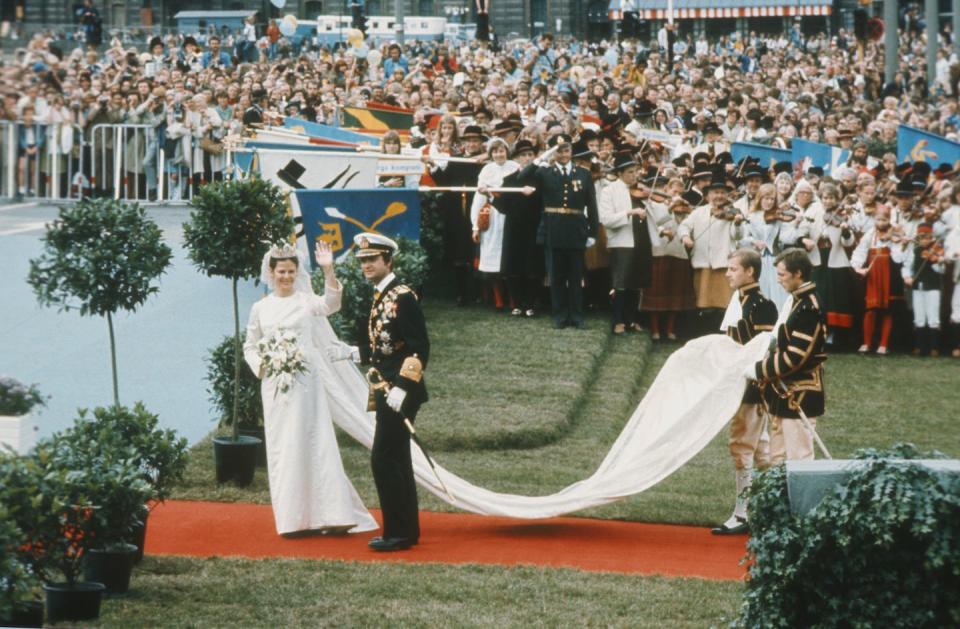 <p>Sweden's current queen wore a long-sleeve sheath that featured a stunning train when she married Carl XVI Gustaf.</p>