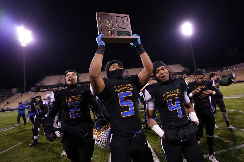 Nov 18, 2022; Columbus, Ohio, USA;  Gahanna's Brennen Ward (2), Jaden Yates (5) and Diore Hubbard (4) celebrate following their 25-17 win over the New Albany Eagles in the high school football Div. I regional final at Historic Crew Stadium. Mandatory Credit: Adam Cairns-The Columbus Dispatch