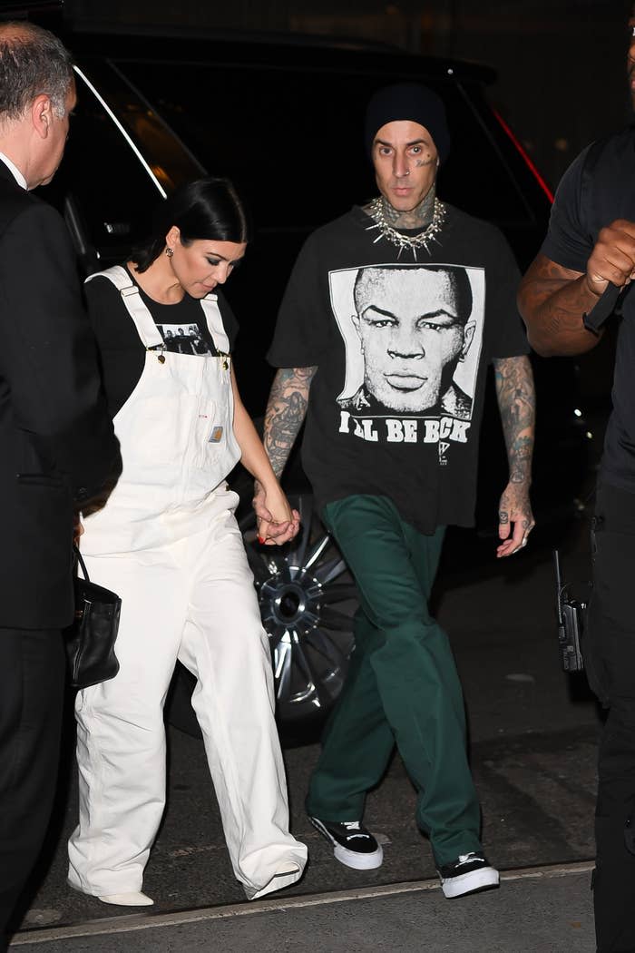 Close-up of Travis and Kourtney holding hands