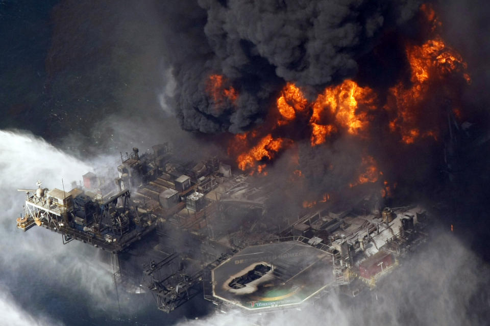 FILE - In an April 21, 2010, file photo taken in the Gulf of Mexico more than 50 miles southeast of Venice, La., the Deepwater Horizon oil rig burns. Jimmy Harrell, a supervisor on the Deepwater Horizon oil rig that exploded in the Gulf of Mexico in 2010, has died at age 65. Harrell, who worked for rig owner Transocean, died Monday, May 10, 2021, according to Wolf Funeral Home in Morton, Miss. He had battled cancer for a year. (AP Photo/Gerald Herbert, File)