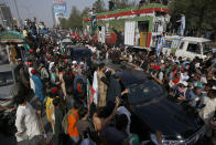 Supporters of Pakistan’s defiant former Prime Minister Imran Khan take part in an anti-government rally in Islamabad, Pakistan, Thursday, May 26, 2022. Khan early Thursday warned Pakistan's government to set new elections in the next six days or he will again march on the capital along with 3 million people. (AP Photo/Anjum Naveed)