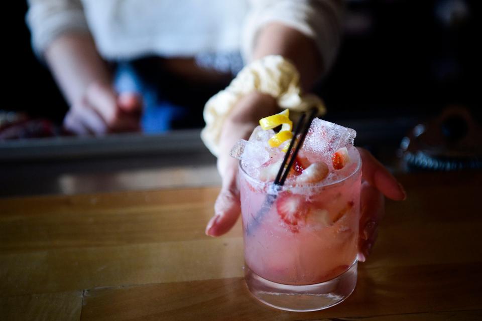 Bartender Bekah Holz serves up her custom-made strawberry spritzer mocktail at Central Depot, 103 W Depot Ave., in the Old City in downtown Knoxville, Tenn. on Wednesday, Nov. 17, 2021.