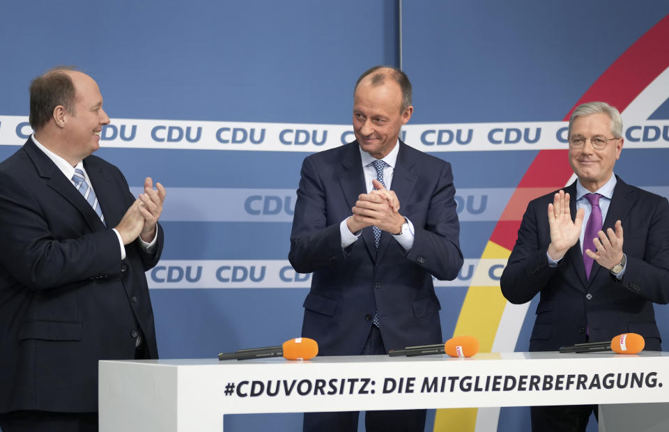 From left, candidate Helge Braun, new elected party chairman Friedrich Merz and candidate Norbert Roettgen, attend a press conference of the German Christian Democratic Party (CDU) at the party's headquarters in Berlin, Germany, Friday, Dec. 17, 2021 to announce the results of a ballot on who will become its new leader. (AP Photo/Michael Sohn)