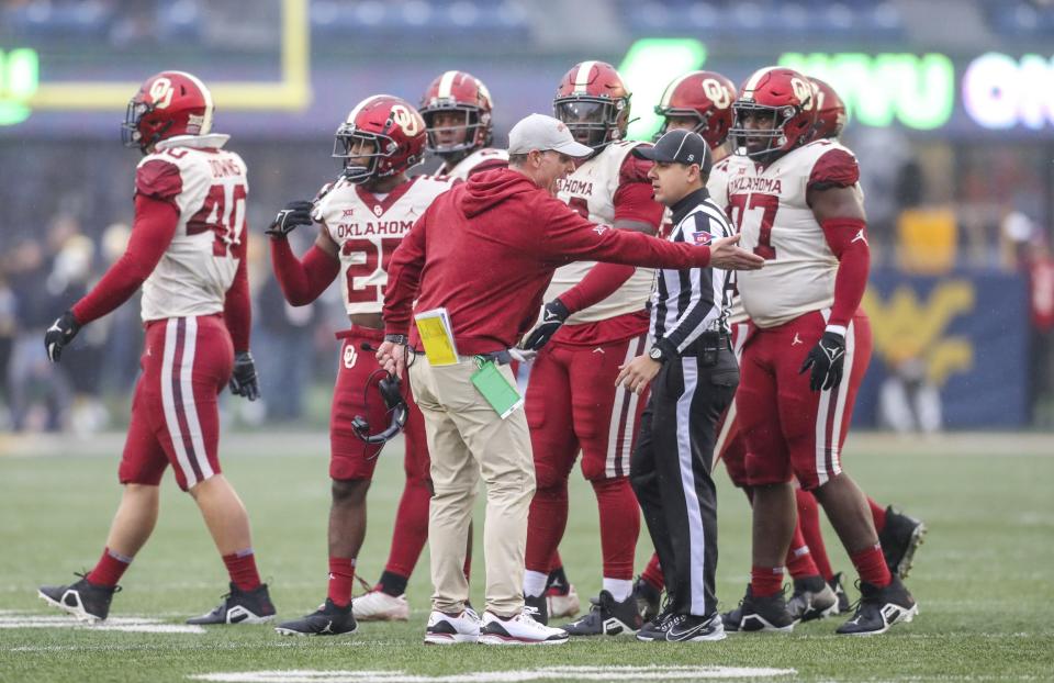 Nov 12, 2022; Morgantown, West Virginia, USA; Oklahoma Sooners head coach Brent Venables argues a call with an official during the first quarter against the West Virginia Mountaineers at Mountaineer Field at Milan Puskar Stadium.