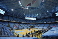 North Carolina and College of Charleston tip off in front a limited crowd due to COVID-19 restrictions, at the Dean E. Smith Center during the first half of an NCAA basketball game in Chapel Hill, N.C., Wednesday, Nov. 25, 2020. (AP Photo/Gerry Broome)