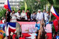 The float of the MMFF 2012 entry, "El Presidente" makes its way through the crowd at the 2012 Metro Manila Film Festival Parade of Stars on 23 December 2012. (Angela Galia/NPPA Images)