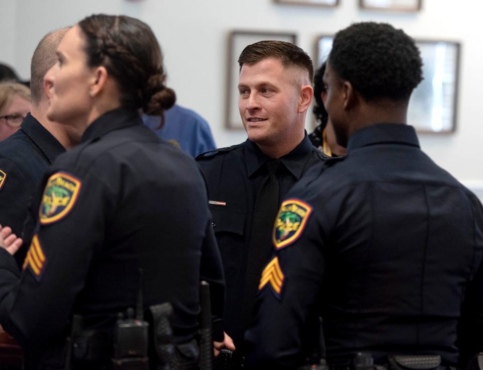 Palm Beach Police Sgt. Robert Mastrangelo celebrates his promotion Friday during the police department promotional and awards ceremony at Town Council Chambers.